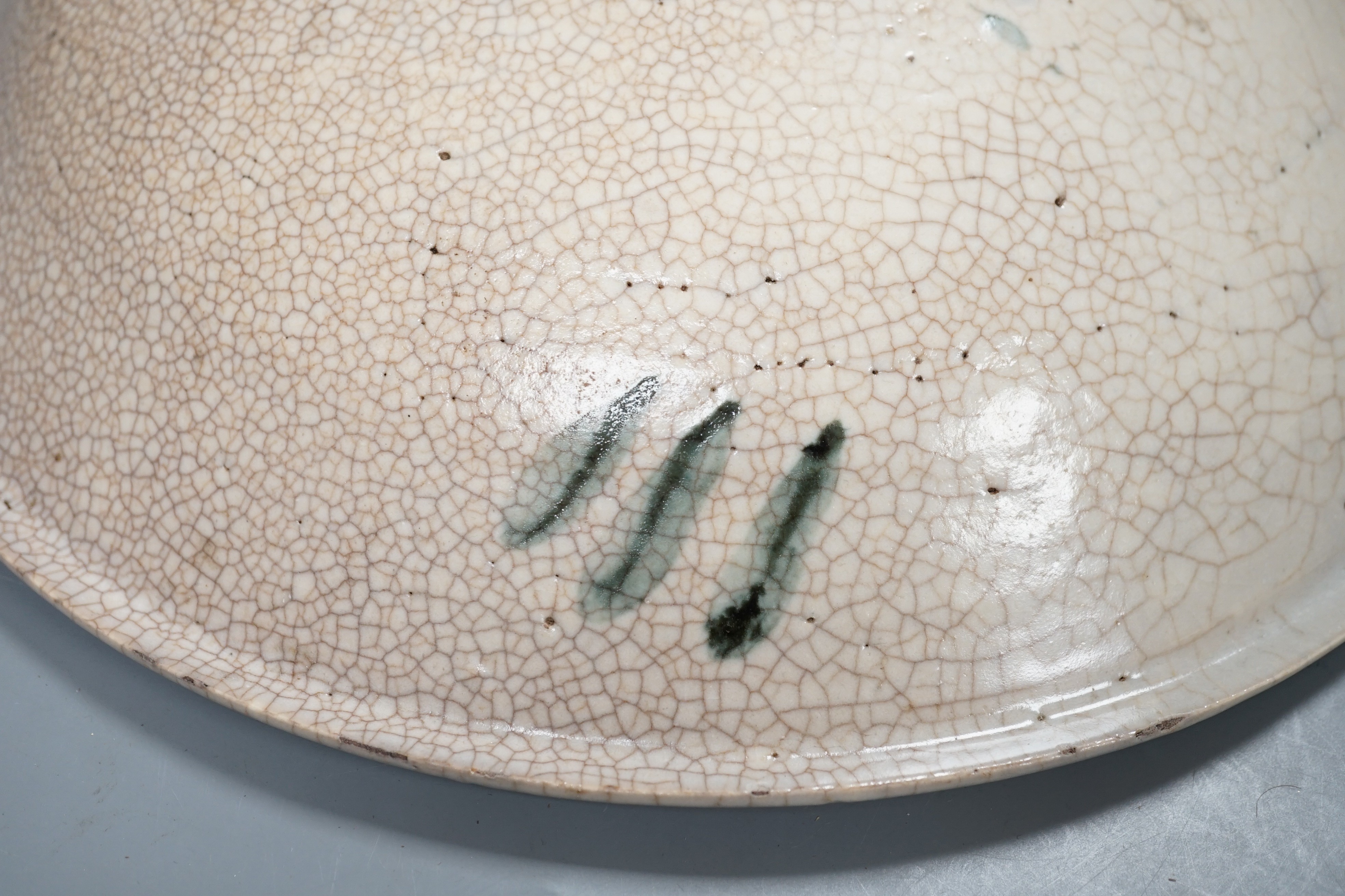 A Chinese provincial blue and white ‘kitchen Qing’ dish 32.5cm diameter